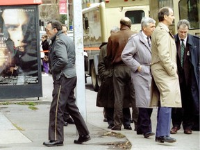 A Secur guard (left) walks outside a Provigo supermarket in Notre-Dame-de-Grâce on Nov. 22, 1994, where his two partners were shot in a robbery.