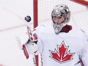 Team Canada goalie Carey Price eyes the puck while playing against team USA during third period of World Cup of Hockey action in Toronto on Tuesday, Sept. 20, 2016.