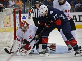 Team Canada's Carey Price (31) and Team USA's Ryan Kesler (17) during World Cup tournament on Friday: No matter how good the hockey, it makes zero sense to risk the goalie's wonky knee, Jack Todd says.