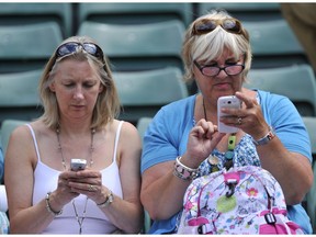It's common to see people checking their phones: Many new words are expressions of and for a technological culture, Mark Abley writes.