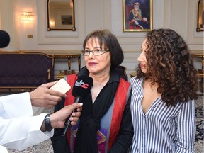 Retired Iranian-Canadian professor Homa Hoodfar, left, speaks to the media in Muscat airport, Oman, after being released by Iranian authorities, Monday, Sept. 26, 2016,
