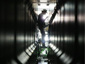 Workers install the "K Computer" supercomuter at Japan's Riken institute laboratory in 2011.