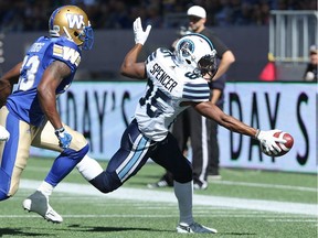 Toronto Argonauts WR Diontae Spencer reaches for the corner of the end zone on a touchdown catch with Winnipeg Blue Bombers DB Kevin Fogg in pursuit during CFL action in Winnipeg on Sat., Sept. 17, 2016. Kevin King/Winnipeg Sun/Postmedia Network
