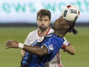 Toronto FC's Drew Moor (3) vies for the ball with Montreal Impact's Didier Drogba during first half MLS soccer action in Toronto on Saturday, August 27, 2016.