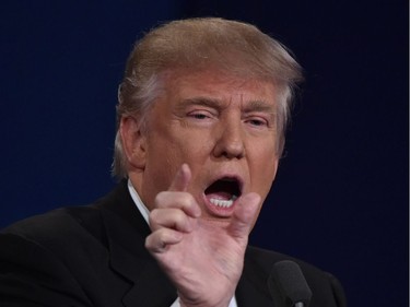 Republican presidential candidate Donald Trump makes a point during the first presidential debate at Hofstra University in Hempstead, New York on September 26, 2016.