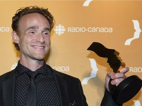 Vincent Leclerc holds up his award for his role in Les Pays-d'en-Haut at the Gala Gemeaux awards ceremony in Montreal, Sunday, Sept. 18, 2016.