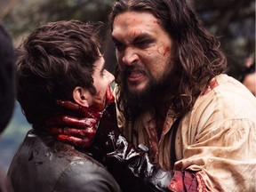 A bloody Declan Harp (Jason Momoa) threatens Michael (Landon Liboiron) in Frontier.