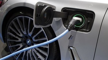 A BMW vehicle is being charged in 2016.