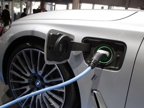 A BMW vehicle is being charged in 2016.