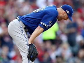 J.A. Happ of the Toronto Blue Jays reacts in the fifth inning against the Cleveland Indians during Game 2 of the American League Championship Series at Progressive Field on Oct. 15, 2016, in Cleveland.