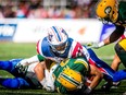 ALouettes cornerback Tyree Hollins tackles Eskimos' kick returner Garry Peters during game at Molson Stadium on October 10, 2016.