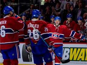 Torrey Mitchell #17 of the Montreal Canadiens celebrates a goal with teammates during the NHL game against Arizona Coyotes at the Bell Centre on Oct. 20, 2016 in Montreal, Quebec, Canada.