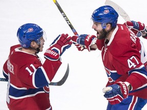 Montreal Canadiens' Brendan Gallagher, left, celebrates his goal against the Philadelphia Flyers with teammate Alexander Radulov during third period NHL hockey action, in Montreal on Monday.