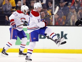 Canadiens' Brendan Gallagher celebrates his goal in front of Boston Bruins' Tim Schaller during the second period of an NHL hockey game in Boston on Saturday, Oct. 22, 2016.