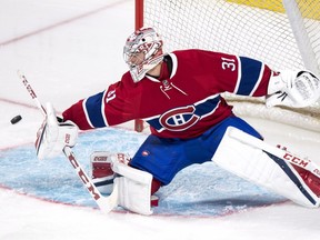Montreal Canadiens goalie Carey Price deflects a shot as they face the Toronto Maple Leafs during first period of NHL pre-season hockey action Thursday, October 6, 2016 in Montreal.