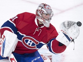 Montreal Canadiens goalie Carey Price gloves the puck during second period NHL hockey action against the Philadelphia Flyers, in Montreal on Monday.