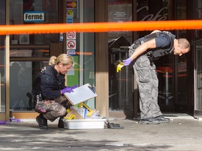 Montreal police investigate a shooting death at Queen Mary Rd. and Westbury Ave. in Montreal. A man in his 30s was shot near Snowdon métro Oct. 2, 2016.