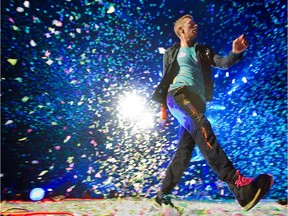 Chris Martin of Coldplay in action at the Bell Centre on July 26, 2012.