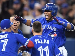 Toronto Blue Jays' Edwin Encarnacion celebrates his walk-off three-run home run during 11th inning American League wild-card game action against the Baltimore Orioles in Toronto, Tuesday, Oct. 4, 2016.