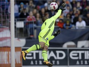 Montreal Impact goalkeeper Evan Bush is unable to stop a ball kicked by New England Revolution forward Diego Fagundez into the net for a goal during the first half of an MLS soccer game, Sunday, Oct. 23, 2016, in Foxborough, Mass. The Revolution won 3-0.