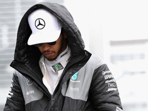 Lewis Hamilton walks to the Mercedes garage before practice for the Mexican Grand Prix at Autodromo Hermanos Rodriguez.