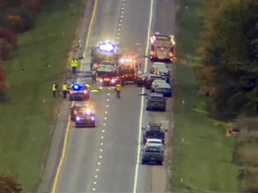 In this still image from video provided by WCAX-TV, workers remove vehicles from Interstate 89 early Sunday, Oct. 9, 2016, in Williston, Vt., after a wrong-way driver caused a crash just before midnight that killed multiple people, before stealing a police cruiser, striking several vehicles and injuring several people. 
 (WCAX-TV via AP)