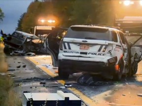 In this still image from video provided by WCAX-TV, workers remove vehicles from Interstate 89 early Sunday, Oct. 9, 2016, in Williston, Vt., after a wrong-way driver caused a crash just before midnight that killed multiple people.