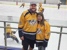 Kyle Osmus and 10-year-old daughter Maggie in Predators jerseys at the Centennial Sportsplex, the team's practice facility in Nashville on Wednesday October 12, 2016.