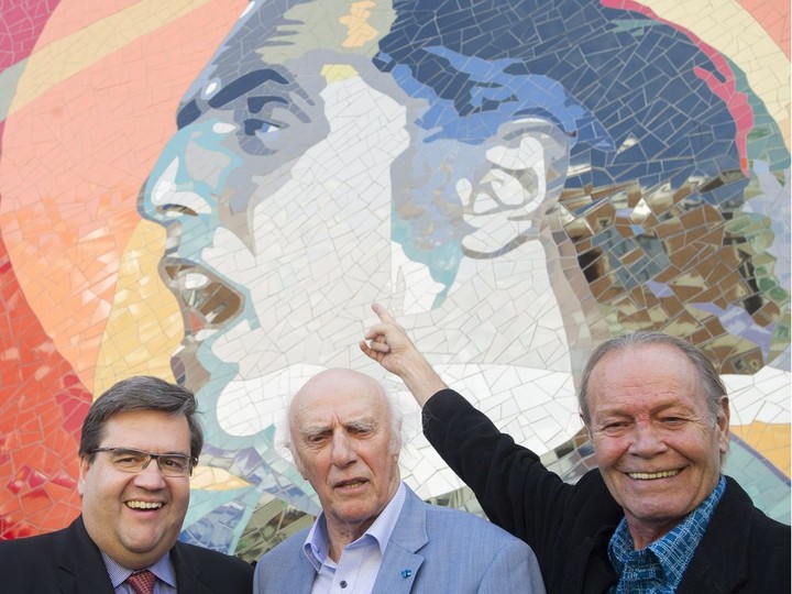  Singer-songwriter Gilles Vigneault, centre, talks with artist Laurent Gascon, right, and Montreal mayor Denis Coderre during the unveiling of a mural in Vigneault’s honour in Montreal, Thursday, October 6, 2016.