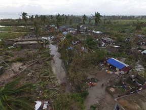 An ariel view shows damaged houses are after the passing of Hurricane Matthew, in Sous Roche in Les Cayes, Southwest Haiti, on October 6, 2016. The storm killed at least 108 people in Haiti, the poorest country in the Americas, with the final toll expected to be much higher. /