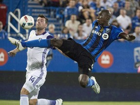 The Montreal Impact and Toronto FC split their two MLS meetings this season, with each winning in the other's stadium. They meet a third time this Sunday at Montreal's Saputo Stadium. Montreal Impact defender Hassoun Camara kicks the ball away from Orlando City FC defender Luke Boden during first half MLS action in Montreal, in a September 7, 2016, file photo.
