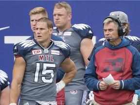 Montreal Alouettes head coach Jacques Chapdelaine, right, and player Samuel Giguere look on from the sideline during first half CFL football action between the Alouettes and the Toronto Argonauts in Montreal, Sunday, October 2, 2016.