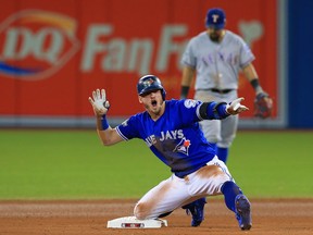 Josh Donaldson of the Toronto Blue Jays reacts after hitting a double in the 10th inning against the Texas Rangers during game three of the American League Division Series at Rogers Centre on Oct. 9, 2016 in Toronto, Canada.