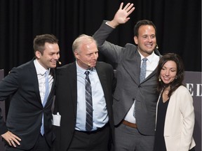 Parti Quebecois leadership candidates Paul St-Pierre-Plamondon, left, Jean-François Lisée, Alexandre Cloutier (waving) and Martine Ouellet get together at the end of the last debate before the leadership, Monday, October 3, 2016 in Quebec City.