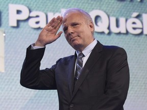 Parti Quebécois leadership candidate Jean-François Lisée waves to supporters after speaking to them before hearing the leadership results, at the Parti Québécois leadership race results evening, Friday, Oct. 7, 2016 in Lévis.