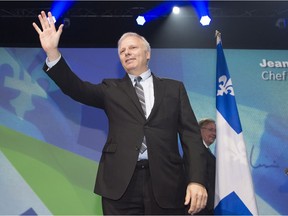 New Parti-Québécois leader Jean-François Lisée waves to supporters after winning the party's leadership on Friday, Oct. 7, 2016, in Lévis.