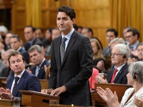 Prime Minister Justin Trudeau delivers a speech at the start of the Paris Agreement debate in the House of Commons on Parliament Hill in Ottawa on Monday, Oct. 3, 2016. Trudeau says the federal Liberal government will establish a "floor price'' on carbon pollution of $10 a tonne in 2018, rising to $50 a tonne by 2022.