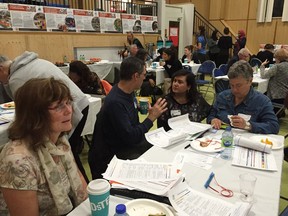 Left to right, Elizabeth Bruineman from the West Island Women's Centre, Pointe-Claire resident Bruno Tanguay, Dina Souleiman from the West Island YMCA and Senneville resident Alison Hackney discuss the finer points of the South West Island action plan.