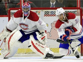 Montreal Canadiens' Brett Lernout (36) clears the puck away from  goalie Al Montoya in Ottawa on Saturday Oct.  1, 2016.