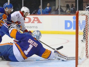 Phillip Danault #24 of the Montreal Canadiens scores at 11:21 of the third period against Thomas Greiss #41 of the New York Islanders at the Barclays Center on October 26, 2016 in the Brooklyn borough of New York City.