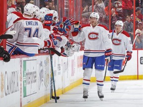 Jeff Petry of the Montreal Canadiens celebrates his second period goal at the bench with teammates against the Ottawa Senators during an NHL game at Canadian Tire Centre on Oct.15, 2016, in Ottawa.
