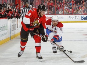Canadiens' Shea Weber poke checks the puck against Mike Hoffman of the Ottawa Senators during an NHL game at Canadian Tire Centre on Oct. 15, 2016, in Ottawa.