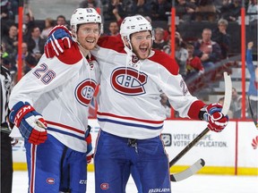 Canadiens' Jeff Petry, left, celebrates his third period goal with teammate Alex Galchenyuk against the Ottawa Senators at Canadian Tire Centre on Oct. 15, 2016, in Ottawa.
