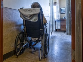 A Montreal senior sits alone in an apartment.