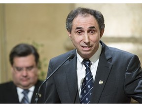 MONTREAL, QUE.: FEBRUARY 24, 2014 -- Normand Marinacci of Le Vrai Changement pour Montréal party and borough mayor of L'Île-Bizard-Sainte-Geneviève, right, makes a speech next to Montreal Mayor Denis Coderre, left, during a ceremony to make former Radio-Canada broadcaster Jacques Languirand an honorary citizen at city hall in Montreal on Monday, February 24, 2014. (Dario Ayala / THE GAZETTE) ORG XMIT: 49301