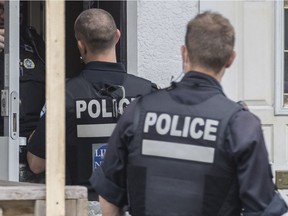 MONTREAL, QUE.: JUNE 2, 2016 -- Montreal police at the scene where Angelo D'Onofrio, a man in his 70s, was shot inside the Hillside Cafe near the corner of Fleury and Andre Jobin streets in Montreal on Thursday, June 2, 2016. (Dario Ayala / Montreal Gazette) ORG XMIT: 56357