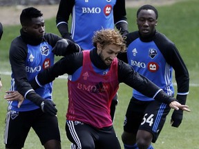 Ballou Jean-Yves Tabla, right, at Impact practice in May, has signed a two-year deal with the MLS team.
