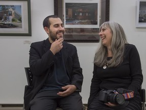 Artists Jonah Migicovsky and his mother Lisa Kimberly Glickman share a laugh during their vernisage of photographs mixed with paintings called Abandoned Re-Imagined at the Kirkland Municipal Library, Sunday October 9, 2016.  (Peter McCabe / MONTREAL GAZETTE)