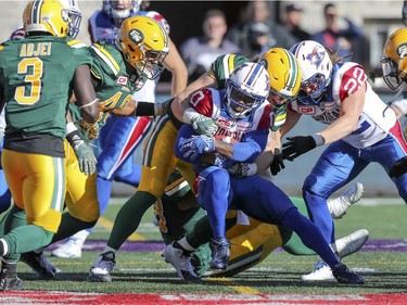 Montreal Alouettes' Stefan Logan is surrounded by Edmonton Eskimos while running back a punt during CFL action at Molson Stadium in Montreal on Monday, Oct. 10, 2016.
