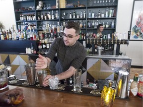 Brandon Linhares mixes drinks at the laid-back Bar Palco on Wellington St. in Verdun.